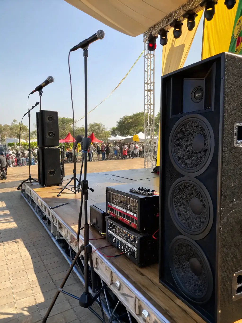 A well-lit image of Beleef's high-quality sound system setup for a live band performance at an outdoor garden party.